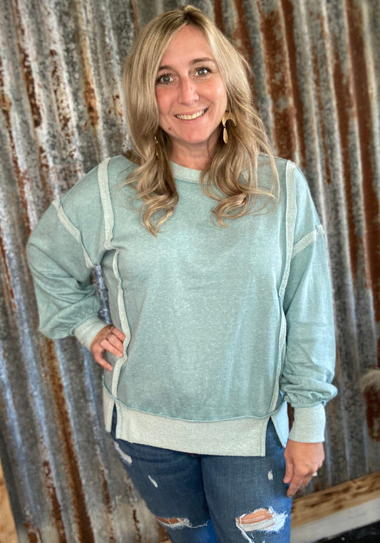 Teal washed bottom band exposed seam sweatshirt